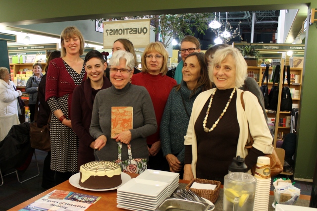 Cutting the cake with Herstorians both current and former, including founding member Erin Shoemaker front and centre!